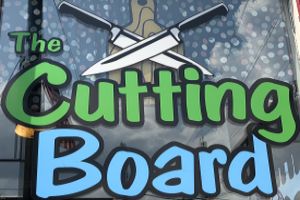 Logo of The Cutting Board in Oswego, NY